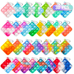Genuvi Pop fidget keychain in hand offering portable sensory fun for kids