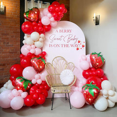 GIZIUXNE strawberry balloon arch kit setup with pink and red balloons for a festive display.