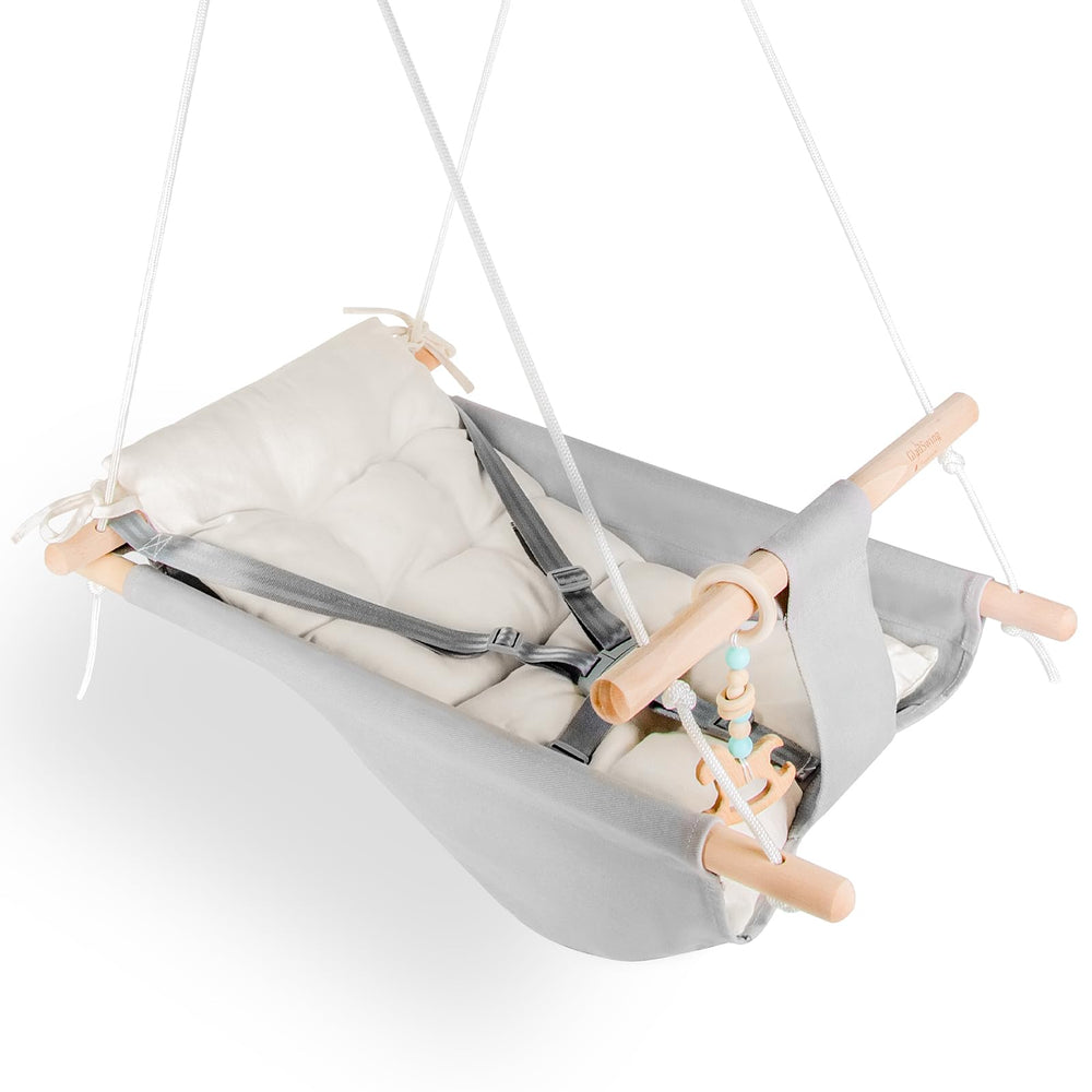 Gladswing baby swing with a gray-white canvas hammock for cozy indoor use