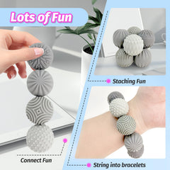 GLMZZ portable case with four textured fidget balls for travel.