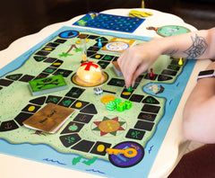 Golden Bell Studios Game board illustration evokes Bikini Bottom adventures.