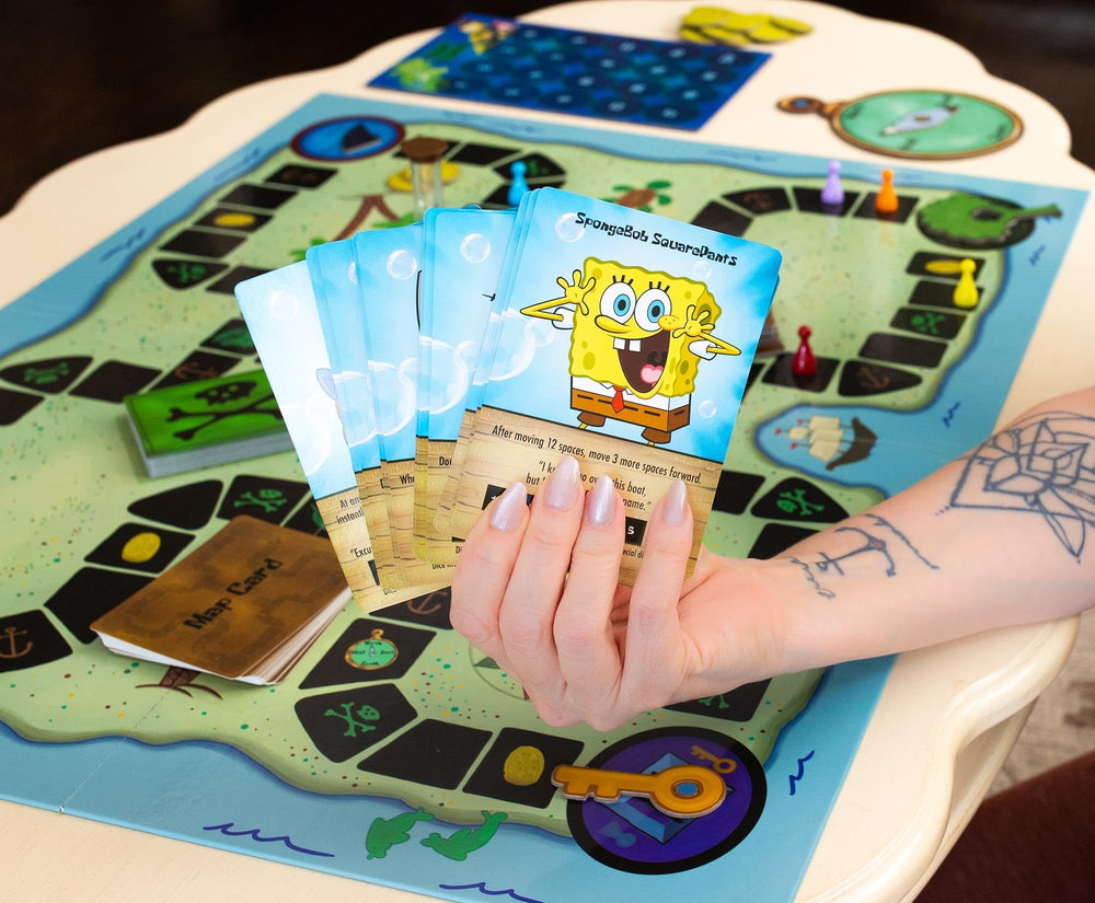 Golden Bell Studios Treasure map cards guide players toward X marks.