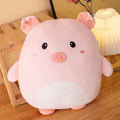 Grafingy Pig plush on bed adds playful decor as a throw pillow.
