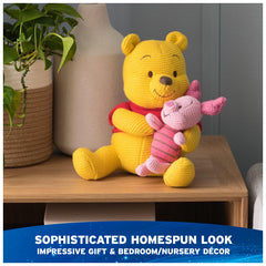 GUND Disney Pooh and Piglet knit plush resting in Pooh's lap, inviting storytime
