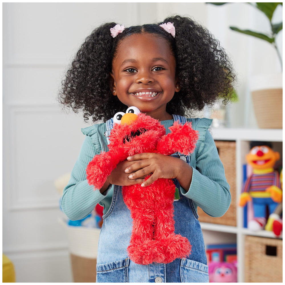 GUND Elmo 13-inch plush smile shot, inviting and comforting for kids.