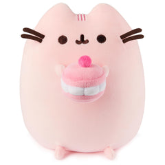 GUND Pusheen Cherry Macaron Squisheen plush holding a macaroon for cozy desk décor.