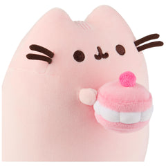 GUND Pusheen holding cherry macaroon close-up, a playful gift-ready image.
