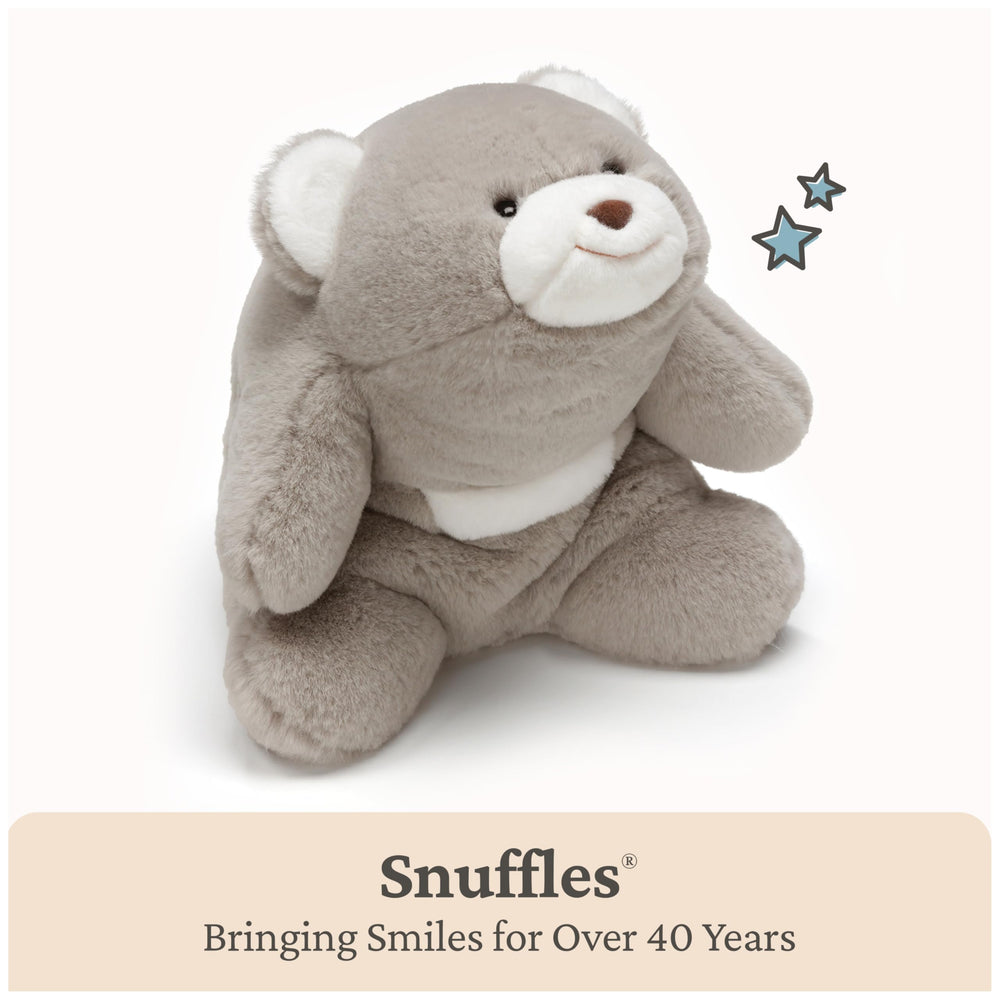 GUND Snuffles hug-back curved shape close-up emphasizing crescent cuddle.