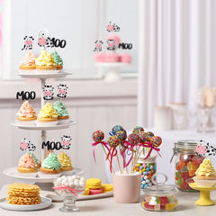Gyufise cow cupcake toppers at baby shower dessert table