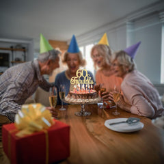Table display featuring Gyufise 60th topper as a focal point.