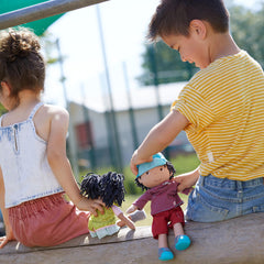 HABA Cari 12in black doll with beanbag bottom makes cuddly storytelling easier.