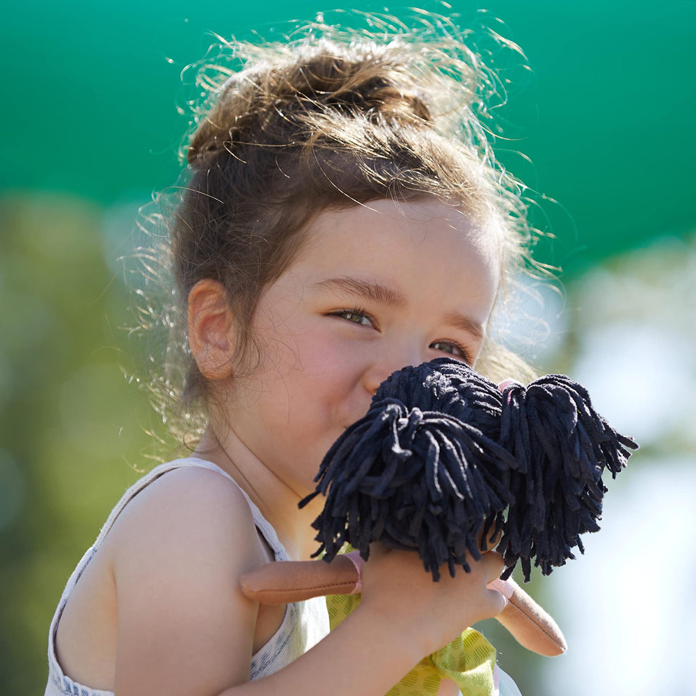 HABA Cari 12in black doll machine washable for quick cleanup.