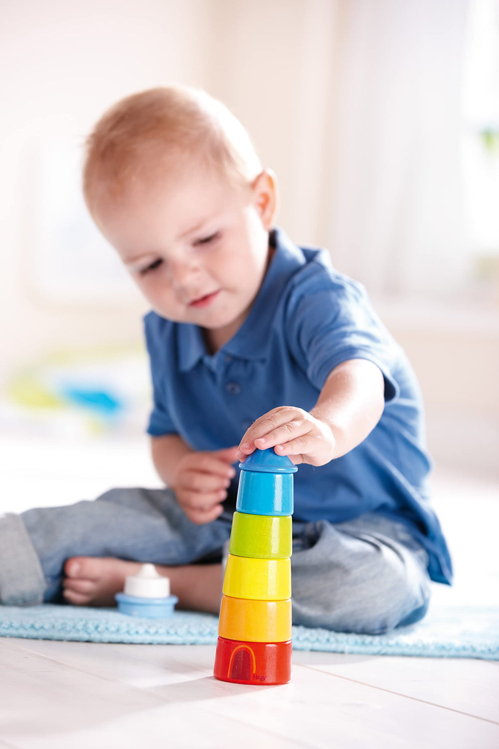 HABA Rainbow Lighthouse educational toy supports Montessori-inspired learning and early problem-solving.