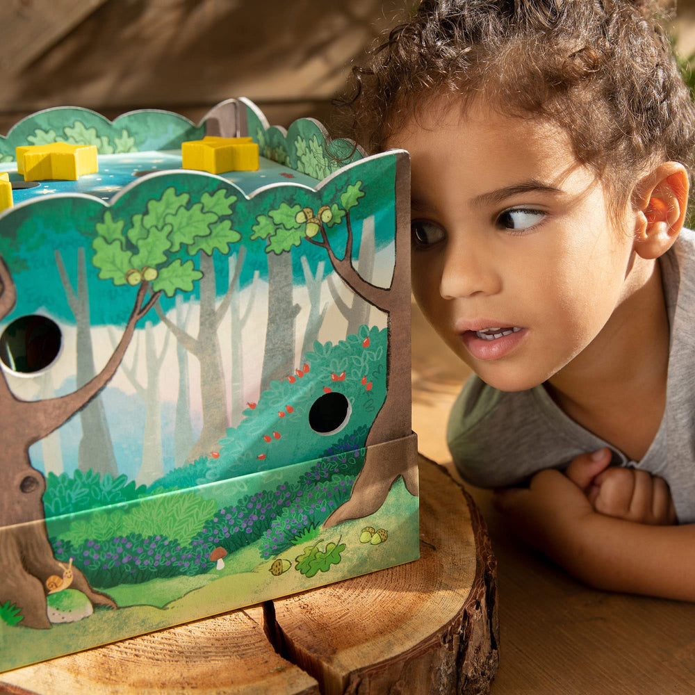 HABA Peepholes invite kids to peek and guess hidden animals.