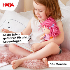 HABA Lilli-Lou embroidered-face with blue eyes invites gentle pretend bonding.
