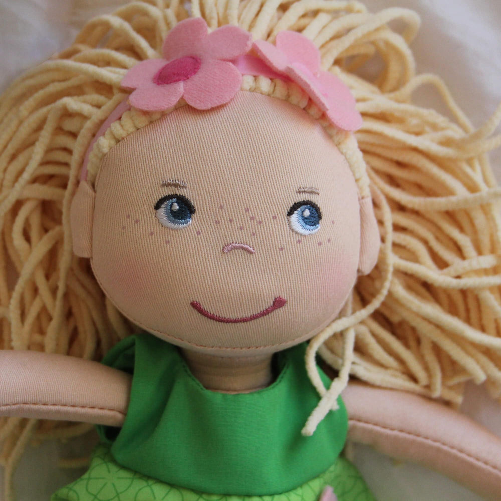 HABA Mali removable outfit components enable versatile dress-up play.