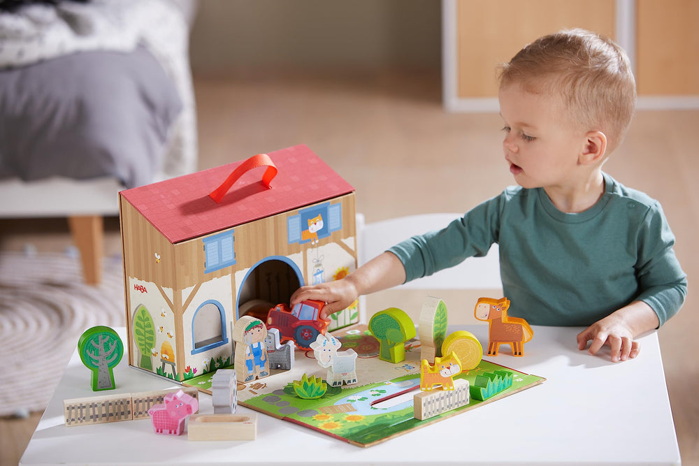 HABA Play World farmhouse packaging with handle for portable farm fun