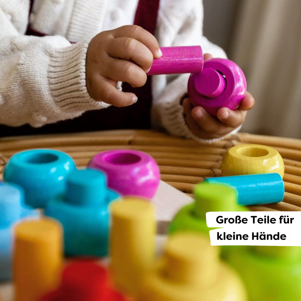 HABA Rainbow Whirls pegging-board invites open-ended play for creative patterns.