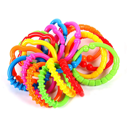 HAHA Baby Link-to-Go rings closeup in bright colors for sensory exploration and teething relief