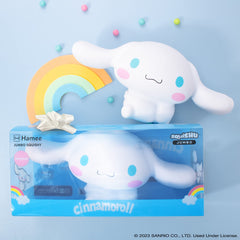 Hamee Cinnamoroll jumbo squishy in hand showing soft texture and size.