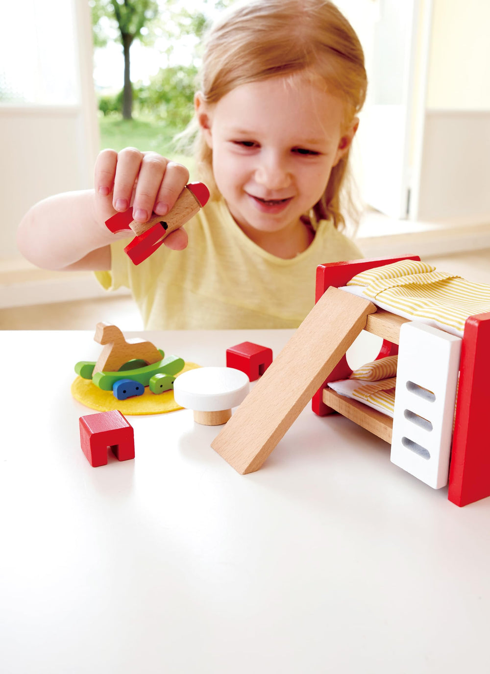 Hape table and chairs create shared meals and storytelling in 1:12 scenes