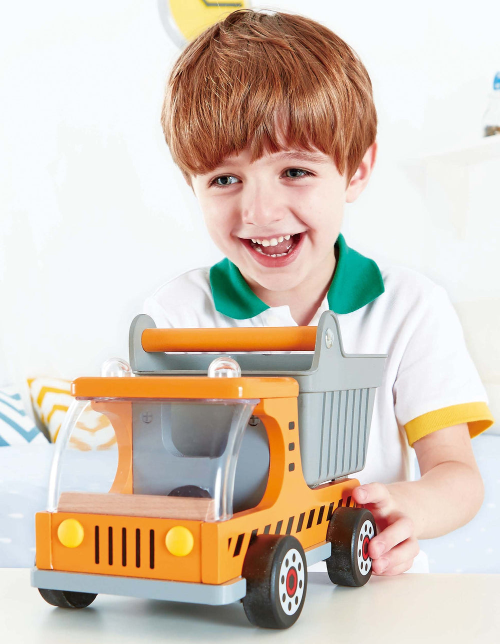 Hape dump truck fuels creative pretend play and motor skills development.