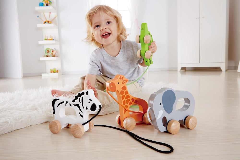 Hape elephant pull-along side view showing compact wooden design for toddlers.