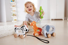 Hape elephant pull-along side view showing compact wooden design for toddlers.