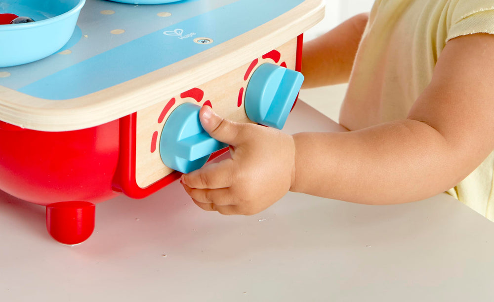 Hape Toddler Kitchen Set pot-lid image includes authentic cooking pot for pretend meals
