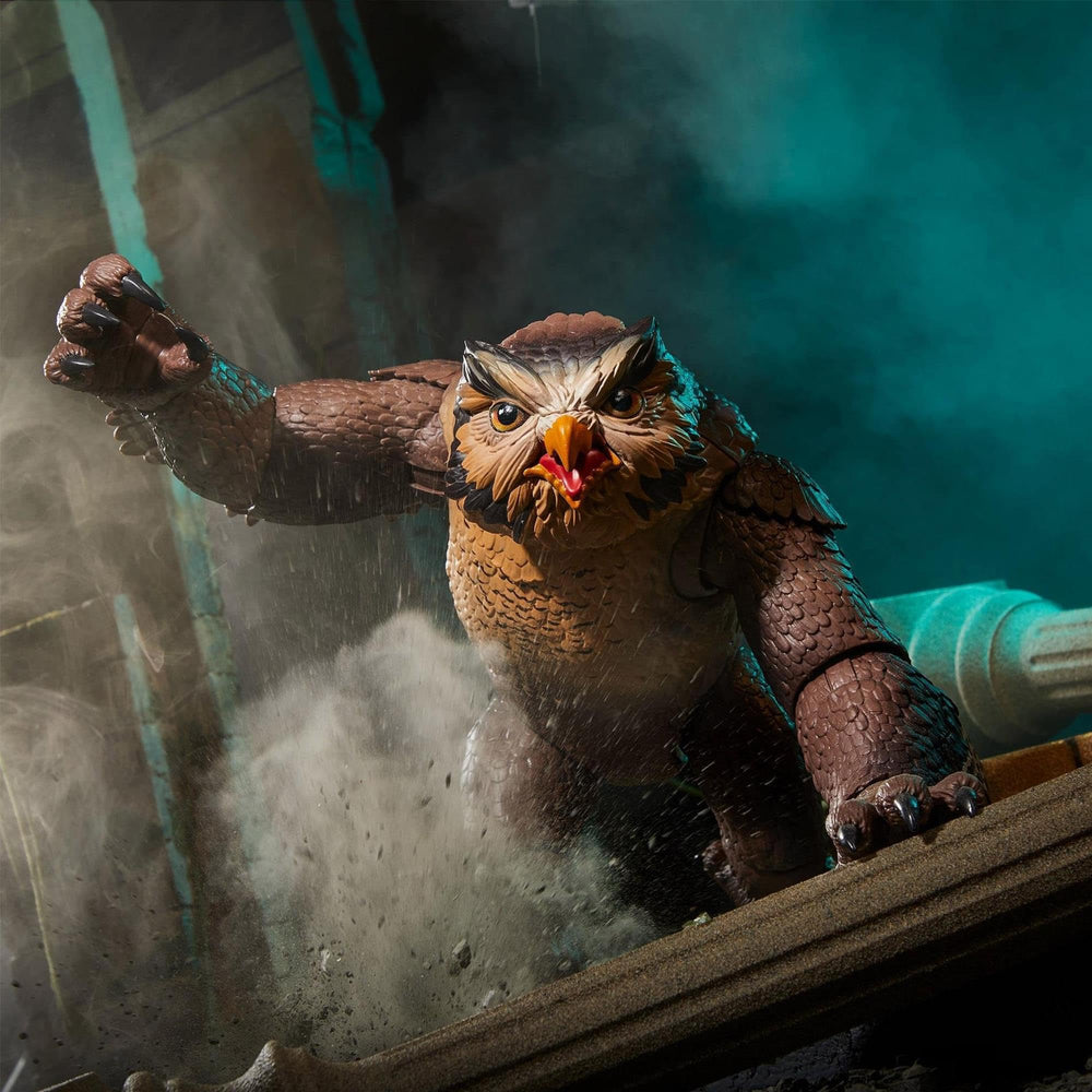 Hasbro Dungeons & Dragons Owlbear figurine, golden finish close-up, premium collectible look.