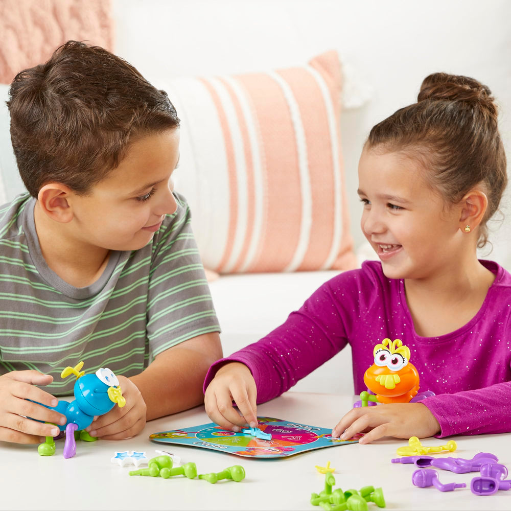 Hasbro Gaming Cootie spinner in action driving creative building.