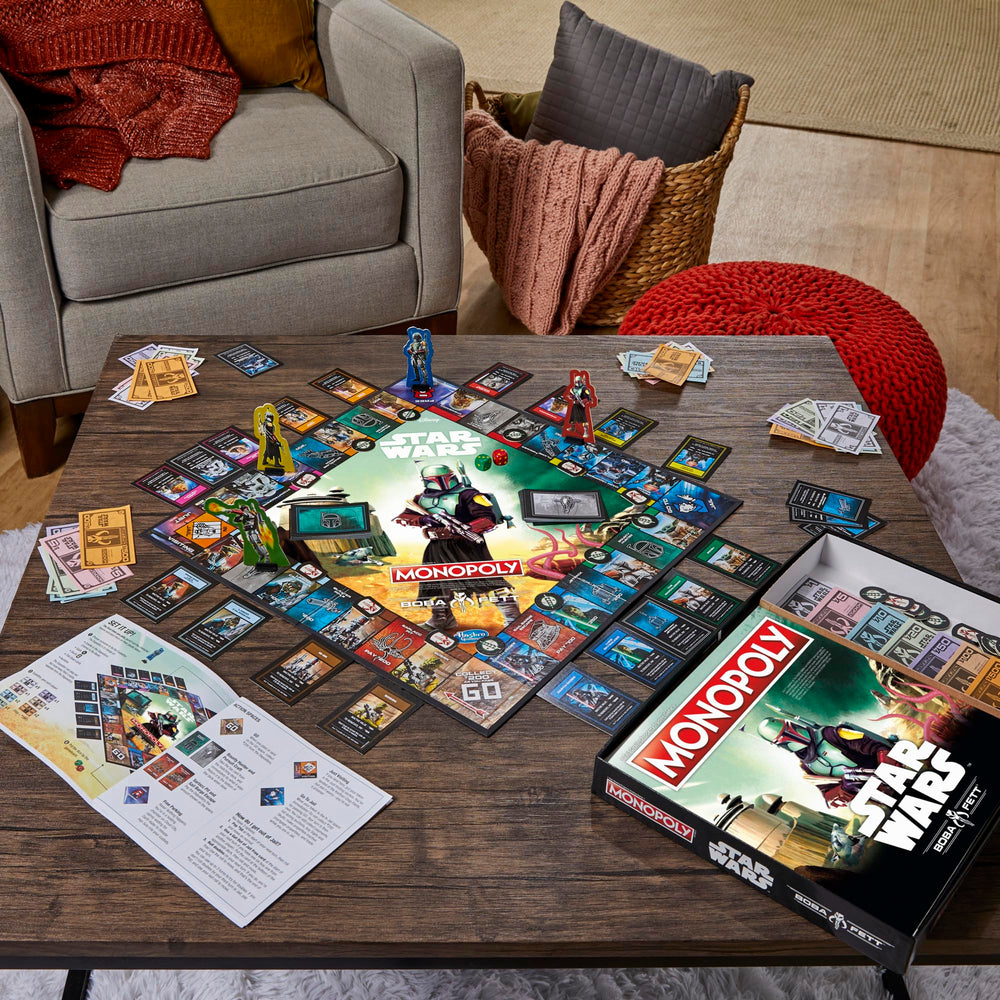 Hasbro Gaming Monopoly Star Wars Boba Fett Edition dice and card components for play.
