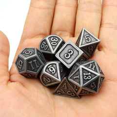 Haxtec burnished blacksmith style dice evoke classic fantasy aesthetics.