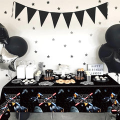 Heboland space tablecloth creates a family-friendly galaxy vibe.