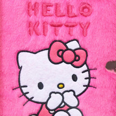 Hello Kitty notebook with smooth ballpoint pen for effortless writing.