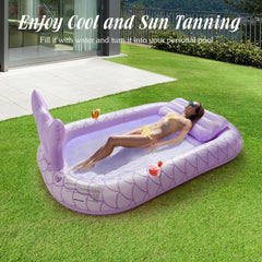 HeySplash inflatable tanning lounger purple, backyard setup for outdoor fun with friends.