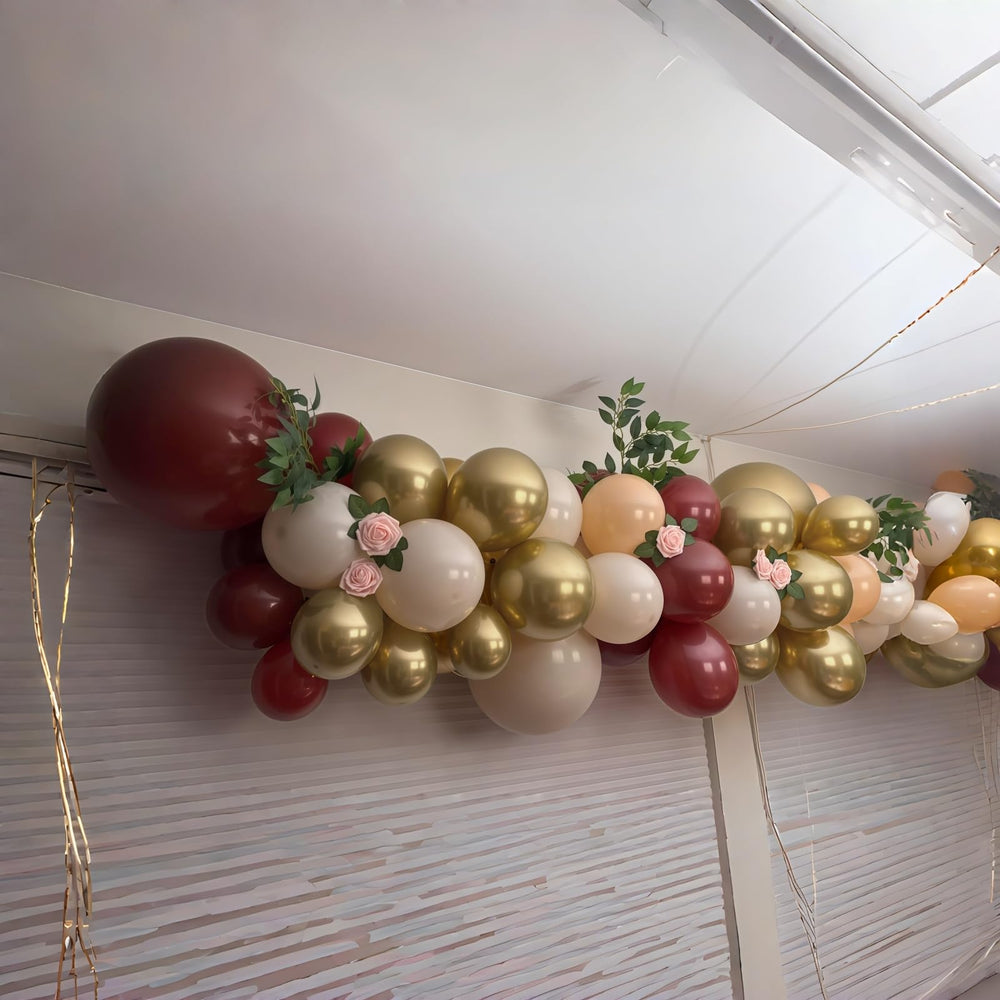 HILAVO graduation party balloons mix deep burgundy with metallic gold for a polished look.