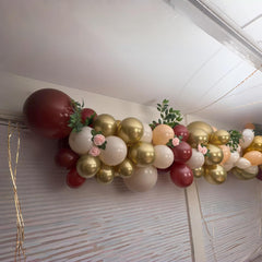HILAVO graduation party balloons mix deep burgundy with metallic gold for a polished look.