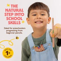 A child holds Honeysticks pencils showing easy triangle grip for small hands.
