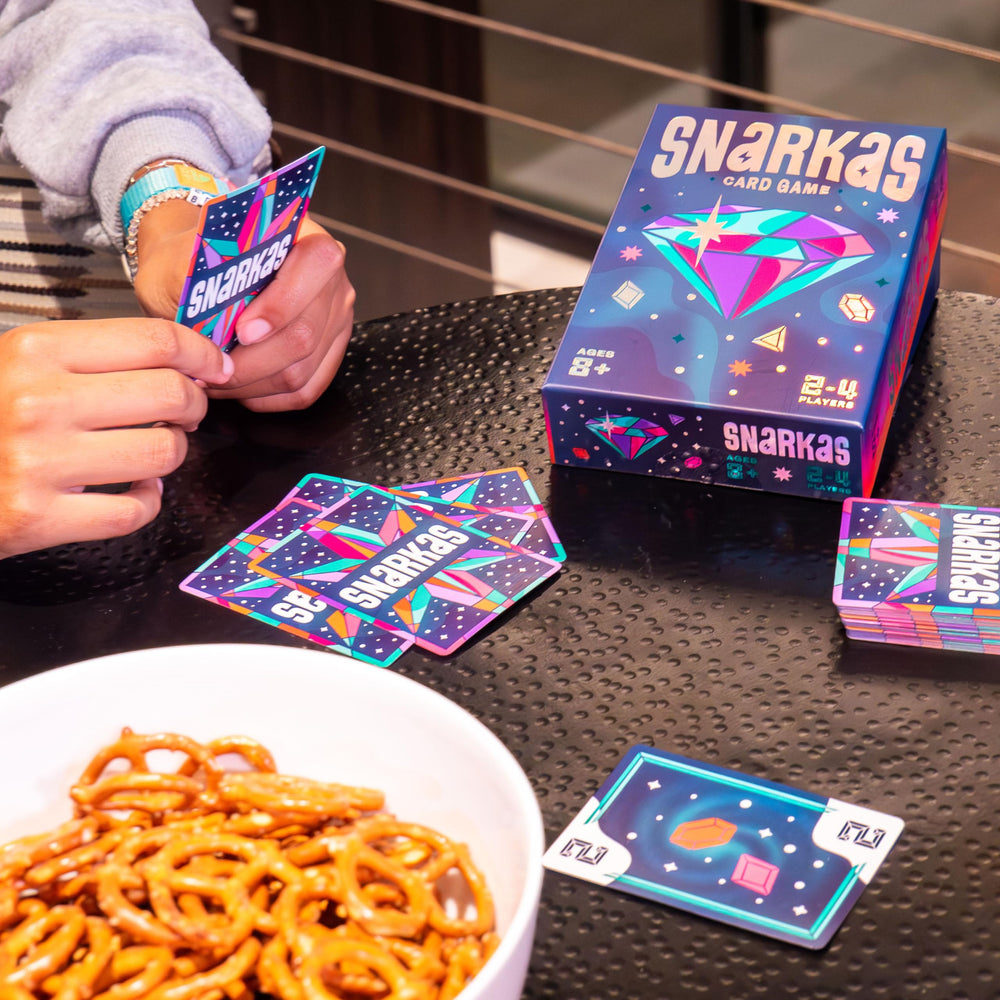 Metallic bonus cards highlight scoring opportunities with Snarkas.