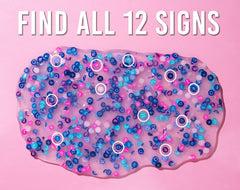 Horoscope charms floating inside Crazy Aaron's Thinking Putty for imagination.