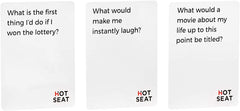 Close-up of Hot Seat card deck with question prompts sparking conversations.