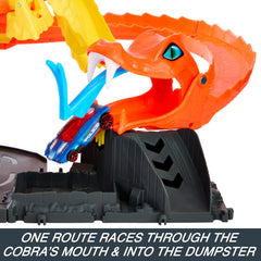 Hot Wheels City car races toward the cobra mouth for dramatic action.
