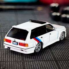 Hot Wheels Elite 64 BMW 318i Touring Spectraflame paint delivers vivid, showroom-style finish.