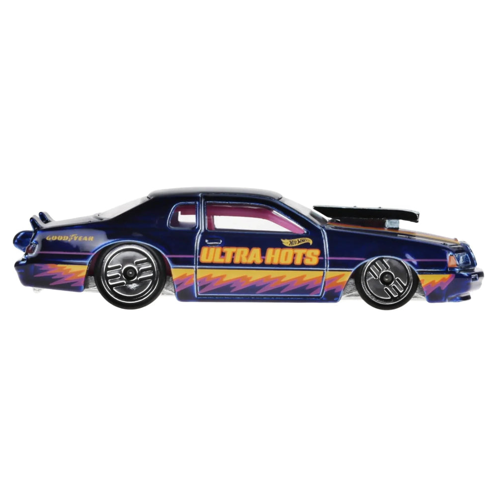 Hot Wheels Porsche 911 Turbo 964 side profile highlights sleek silhouette for display.