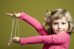Close-up of hands weaving patterns to boost dexterity with House of Marbles