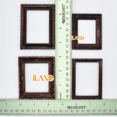 iland dollhouse frames with Roses and Siamese Cat add charm to a bedroom vignette