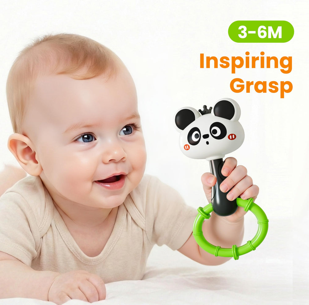 iPlay iLearn Animal shaker in hand with easy grip for tiny fingers.