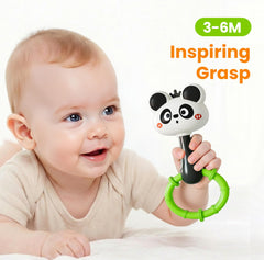 iPlay iLearn Animal shaker in hand with easy grip for tiny fingers.