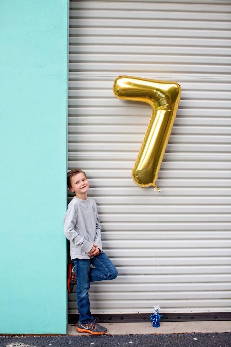 IWERP Gold Number 0 Balloon serves as a focal point on stage for milestones.